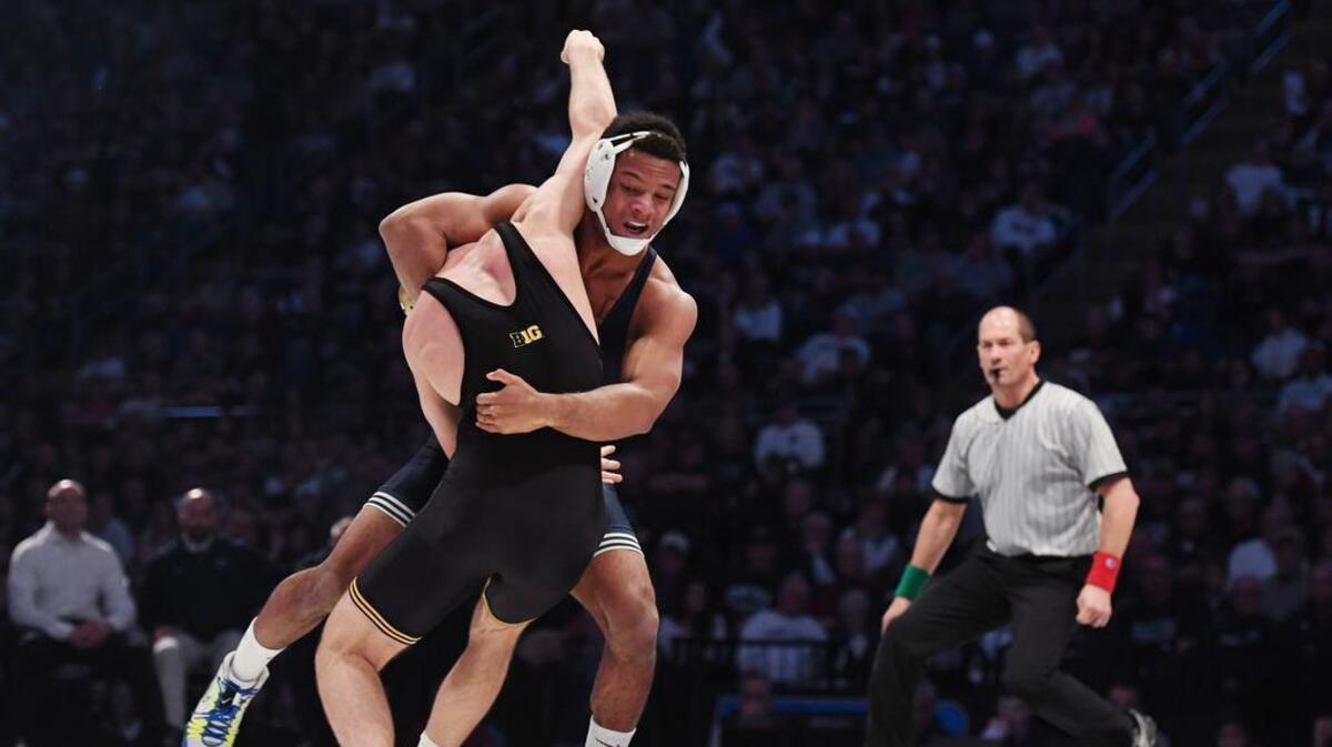 Penn State’s Mark Hall wrestles Iowa’s Joey Gunther in the 174-pound bout during the Nittany Lions’ 28-13 win on Saturday at the Bryce Jordan Center. Hall pinned Gunther in 1:00.