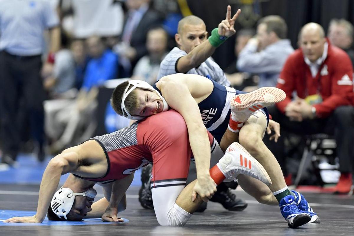 Penn State’s Jason Nolf gets two points in his bout against Rutgers’ John Van Brill in the 157 lb bout during the sweet sixteen round of the NCAA Division 1 Wrestling championships on Thursday, March 21, 2019 at PPG Paints Arena. Nolf won by tech fall at 6:47.