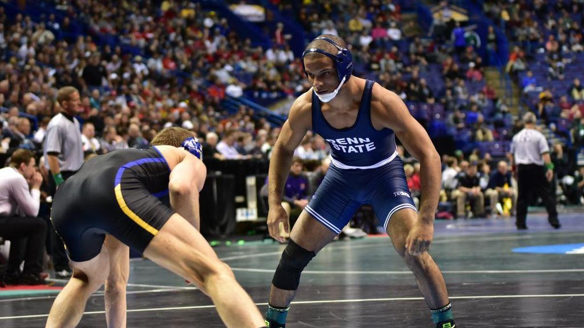 Penn State’s Mark Hall, right, looks for a shot on South Dakota State’s David Kocer in the first round of their 174-pound match of the NCAA championships. Hall topped Kocer 9-2.