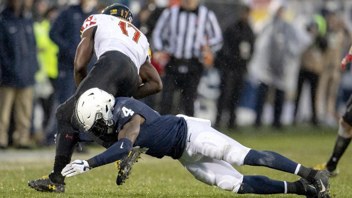 Penn State safety Nick Scott dives for Maryland tight end Chigoziem Okonkwo during the game on Nov. 24, 2018. With Scott graduated, Penn State target Nick Cross would’ve had a chance to make an impact but instead committed to Maryland on Tuesday.