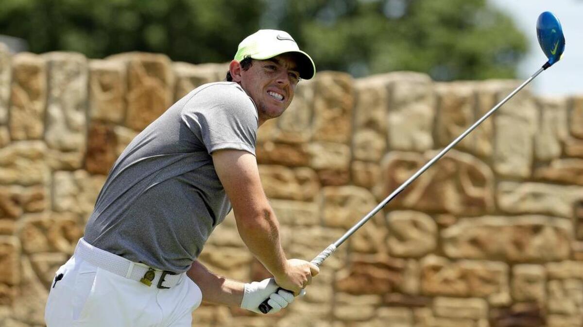 Rory McIlroy, of Northern Ireland, watches his tee shot on the ninth hole during the rain-delayed second round of the U.S. Open at Oakmont Country Club on Saturday.
