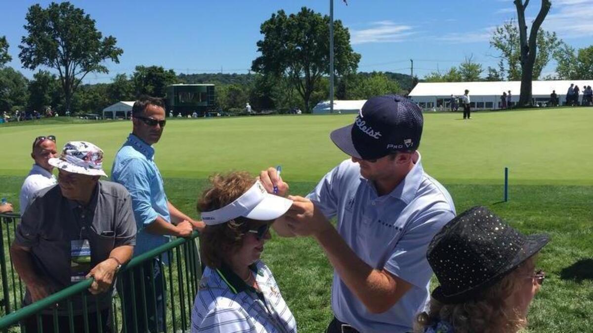 Former Penn State golfer Kevin Foley signs an autograph for a fan earlier this week at the U.S. Open at Oakmont Country Club. Foley was 20 over for his two rounds while fellow Nittany Lion T.J. Howe was 9 over, and both missed the cut.
