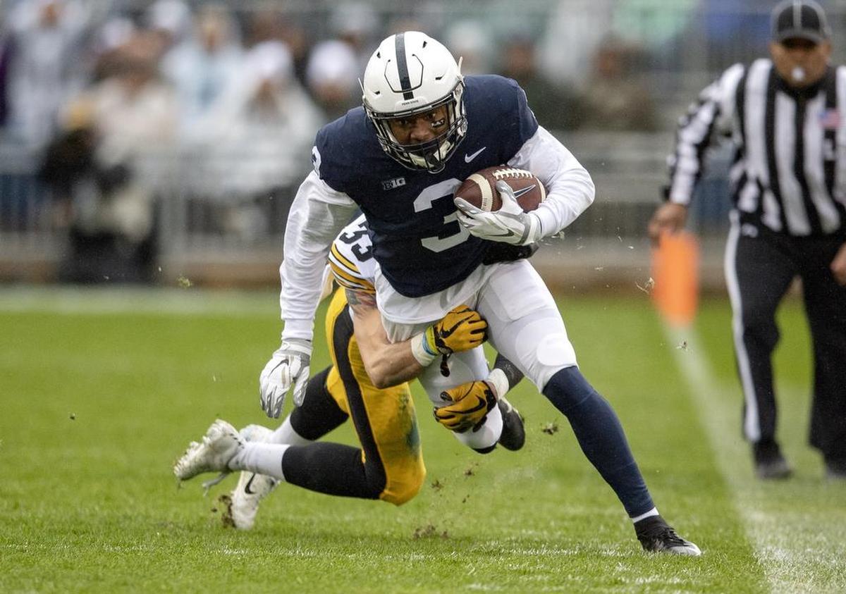 Iowa defensive back Riley Moss tries to trip up Penn State wide receiver DeAndre Thompkins during the game on Saturday, Oct. 27, 2018.