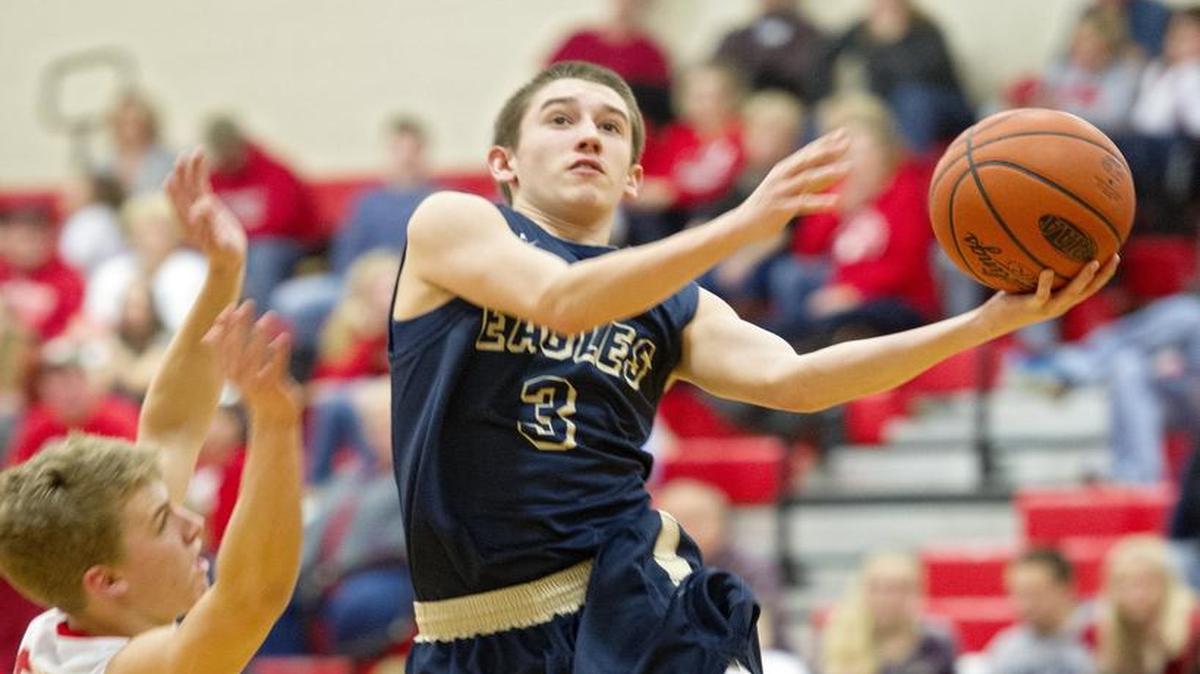 Bald Eagle Area's Brandon Barnyak goes in for a basket around a Bellefonte defender during the boys’ basketball game on Wednesday, January 13, 2016. Bald Eagle Area won, 45-36.