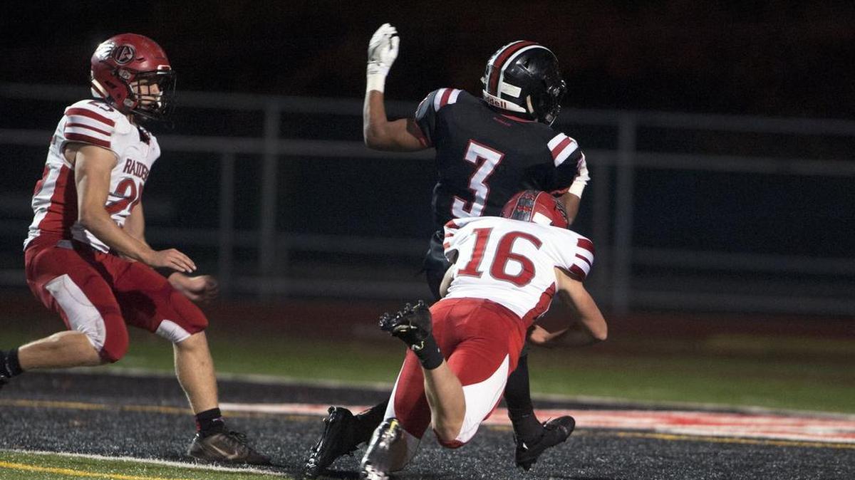 Bellefonte defensive back Nicholas Paloskey attempts to tackle Clearfield running back Seth Caldwell as he scores a touchdown during a game Nov 4, 2016 at Clearfield Area High School.