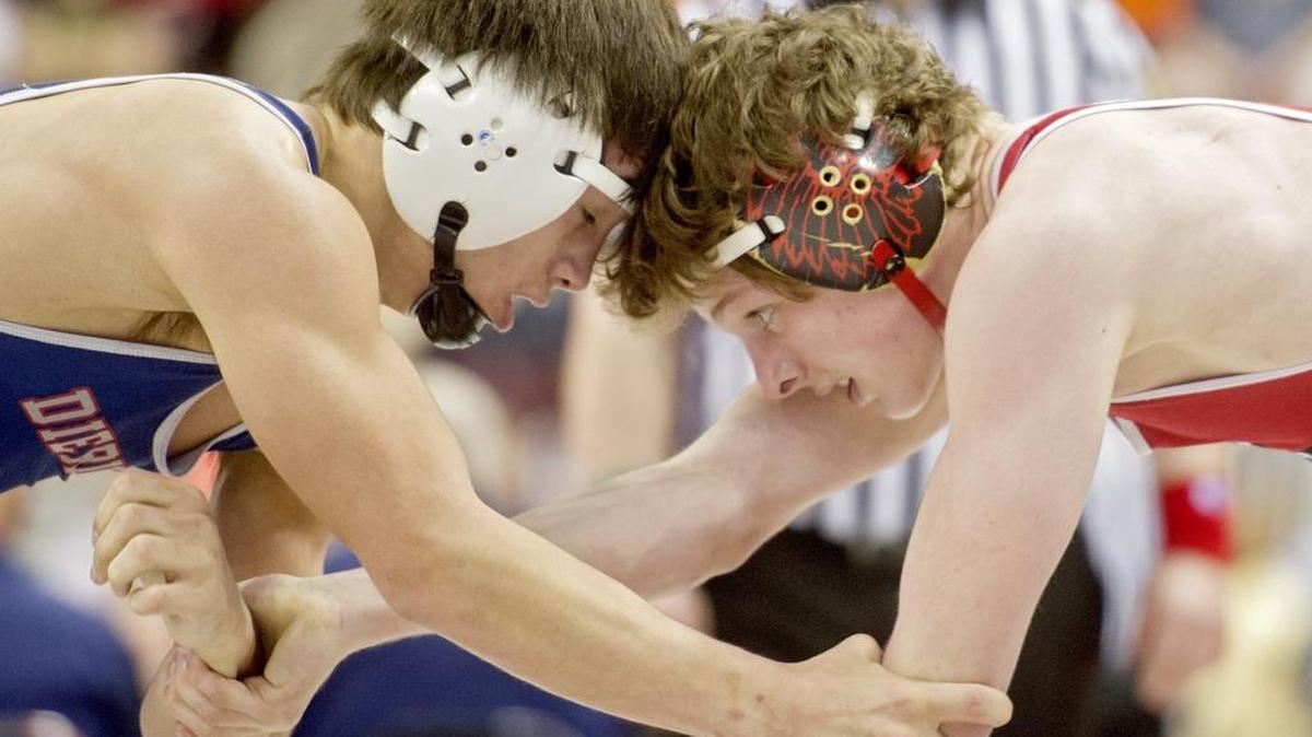 Bellefonte’s Brock Port wrestles Dieruff’s Ronald Nguyen in a 145-pound AAA first round bout during the PIAA State Championship wrestling at the Hershey Giant Center on Thursday. Port won by decision, 7-2.