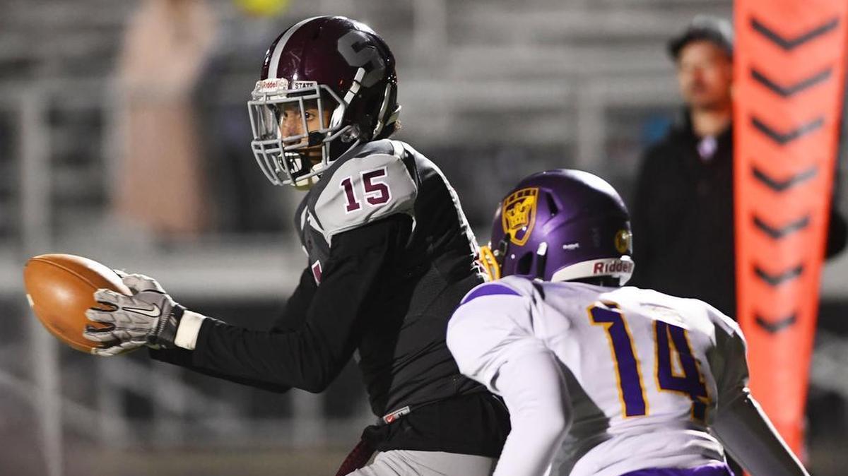 State College wide receiver Brandon Clark makes a catch to score a touchdown during a game against Erie Friday at Clarion's Memorial field.