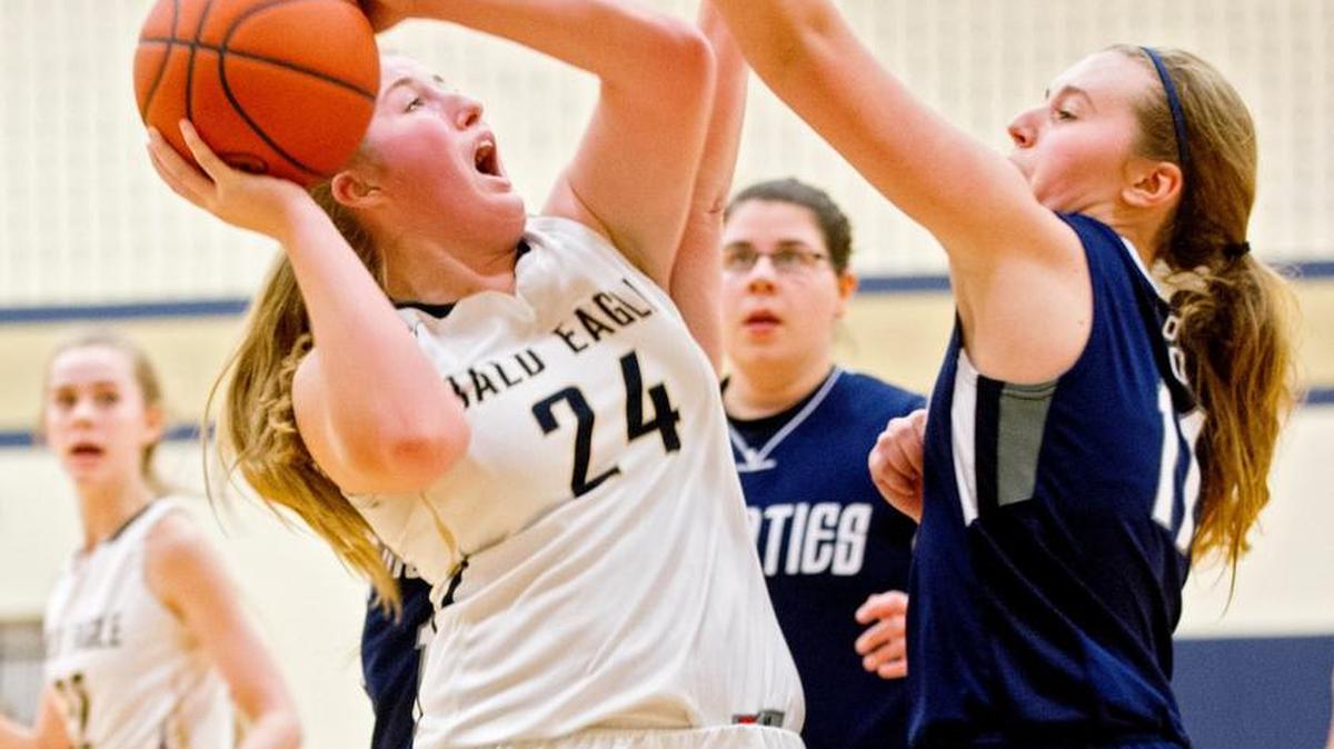 Bald Eagle Area’s Alexis Bucha tries to make a shot over Philipsburg-Osceola defenders in January.