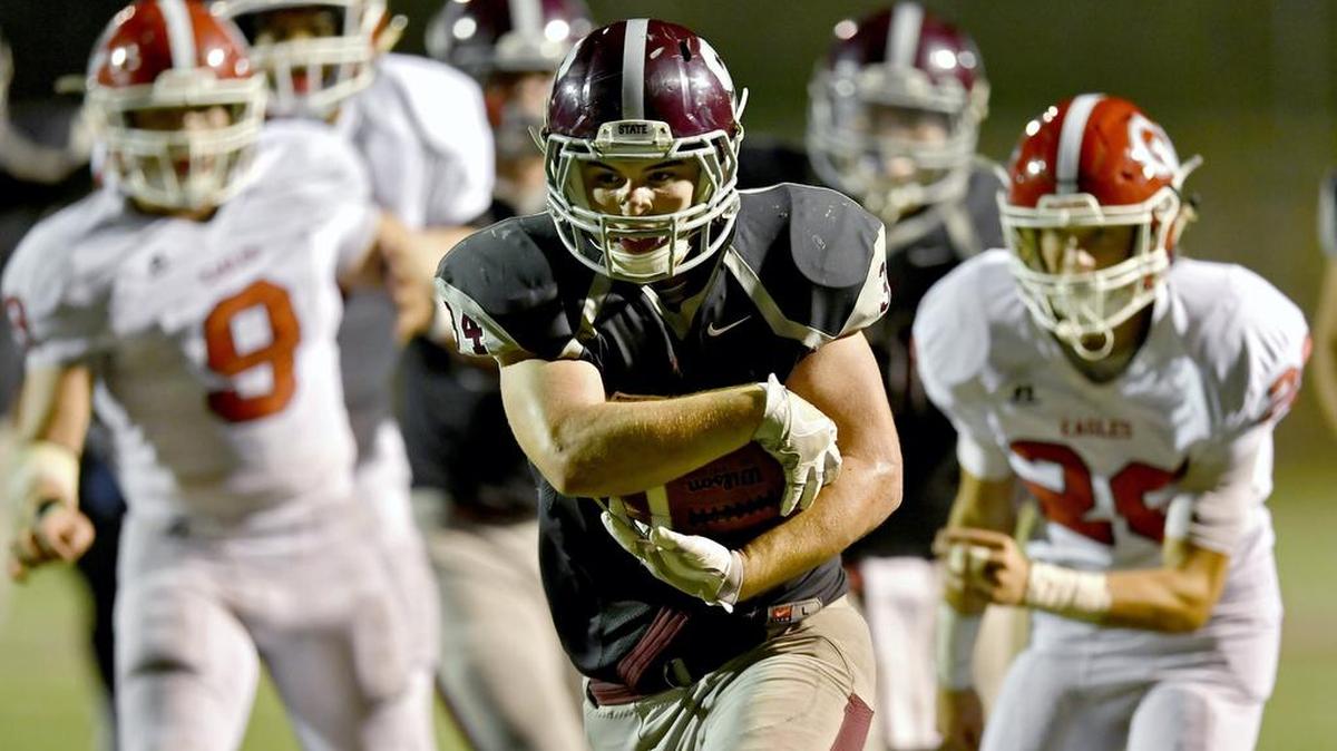 State College’s Pete Haffner runs into the end zone for a touchdown in the fourth quarter last Friday against Cumberland Valley. This week, the Little Lions take on Central Dauphin East.