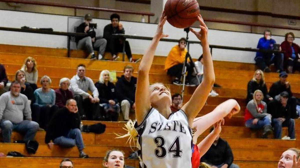 State College’s Elizabeth Czekaj (34) hauls in a rebound during the Lady Little Lions’ 72-62 loss to North Schuylkill in the 26th Annual Kiwani Holiday Classic on Wednesday. Czekaj was one of four State College players in double figures with 12 points.