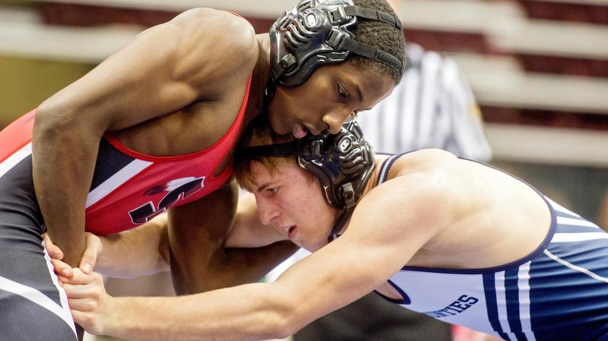 Susquehanna Township's Edmond Ruth and Philipsburg-Osceola's Dakota Weitoish wrestle in a 145 pound AAA first round bout during the PIAA State Championship wrestling at the Hershey Giant Center on Thursday, March 10, 2016. Ruth won in double overtime, 2-1.