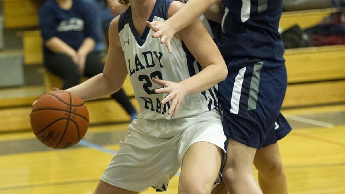 Penns Valley’s Mackenzie Ironside, left, drives past Philipsburg-Osceola’s Loryn Hughes, back, and Cheyenne Bone duringthe Lady Rams’ 54-45 come-from-behind victory on Monday night. Ironside finished the game with 12 points. For more on this game and other high school results, see Scholastic Digest on Page 3B .