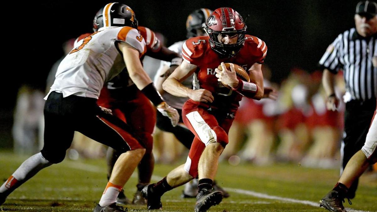 Bellefonte's Dylan Deitrichruns down the field with the ball from Tyrone defenders during the Friday game. Bellefonte won, 49-14. Bellefonte (4-1) scored on its first four drives to race out to a 28-0 lead and never looked back in a dominant performance.