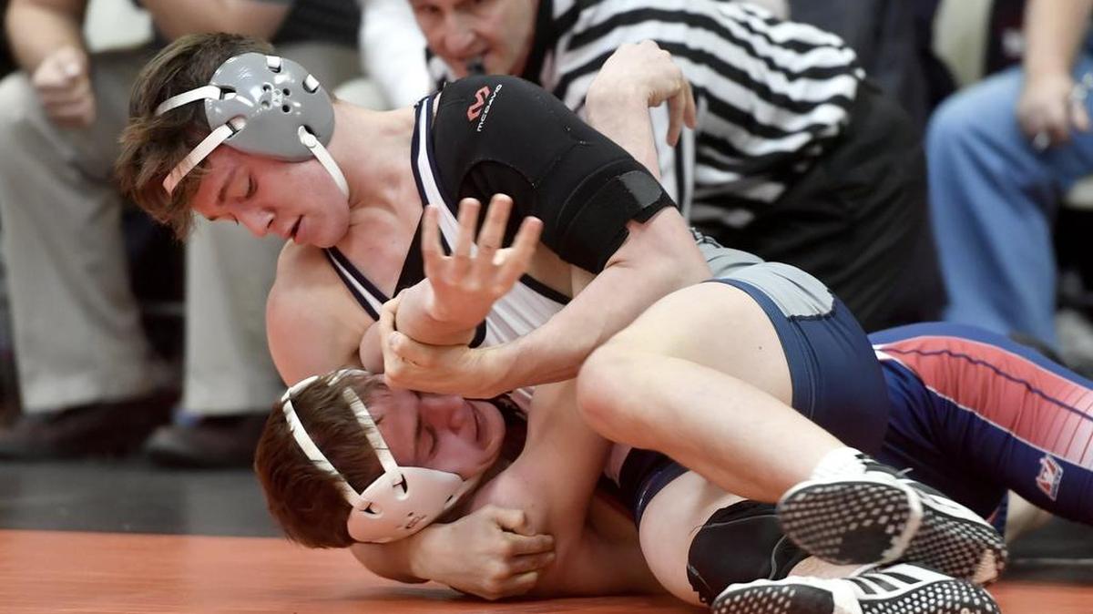 Penns Valley’s Andrew Sharer controls Huntingdon’s Joseph Bailey in the 152-pound bout during the District 6 Class AA team dual semifinals at Tyrone High School on Saturday, February 4, 2017. Sharer won by decision 6-5.