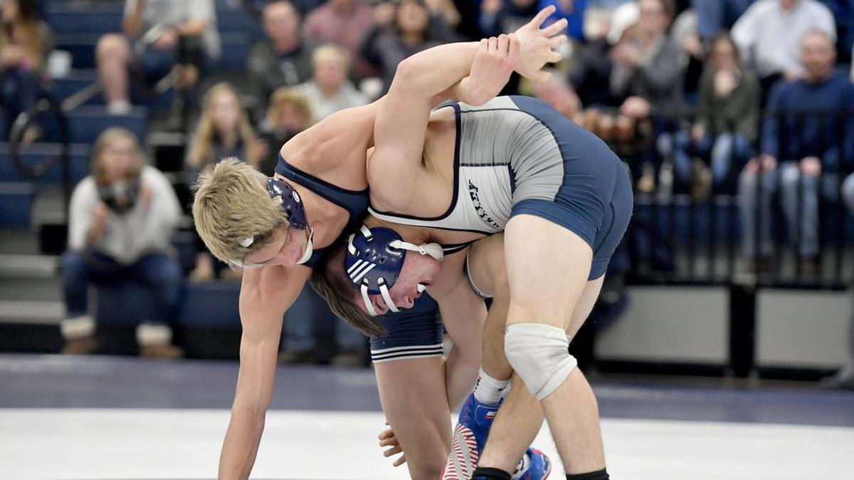 Philipsburg-Osceola's Hunter Weitosh and Penns Valley's Clayton Royer grapple in the 132 lb bout during the match on Tuesday, December 19, 2017. Weitosh won by decision, 5-2.