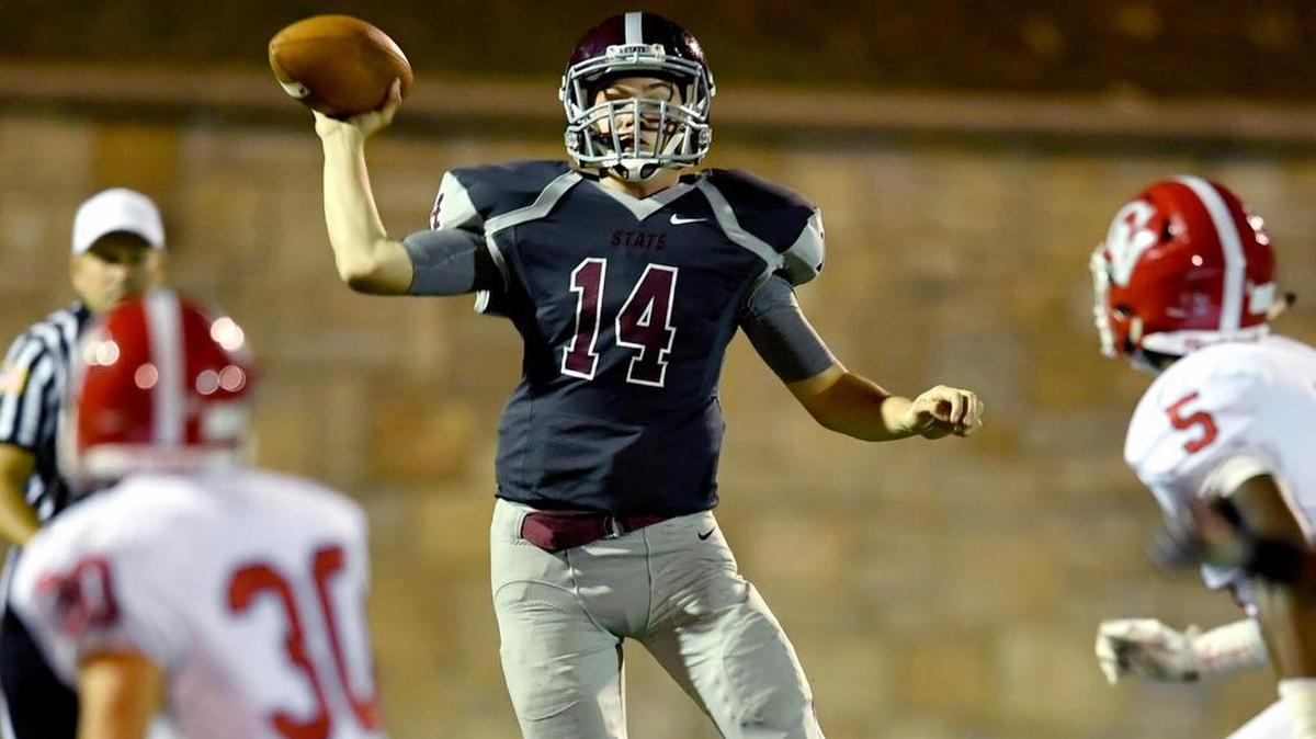 State College’s offensive line faces a tough challenge Friday night against the Harrisburg defensive line as it tries to protect quarterback Tyler Snyder (14).