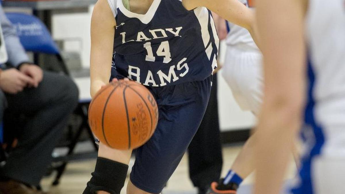 Penns Valley’s Kourtney Beamesderfer dribbles down the court around Saint Joseph’s defenders during Wednesday’s game. The Lady Rams won, 62-29. For more on the matchup, and other high school sports, see 3B.
