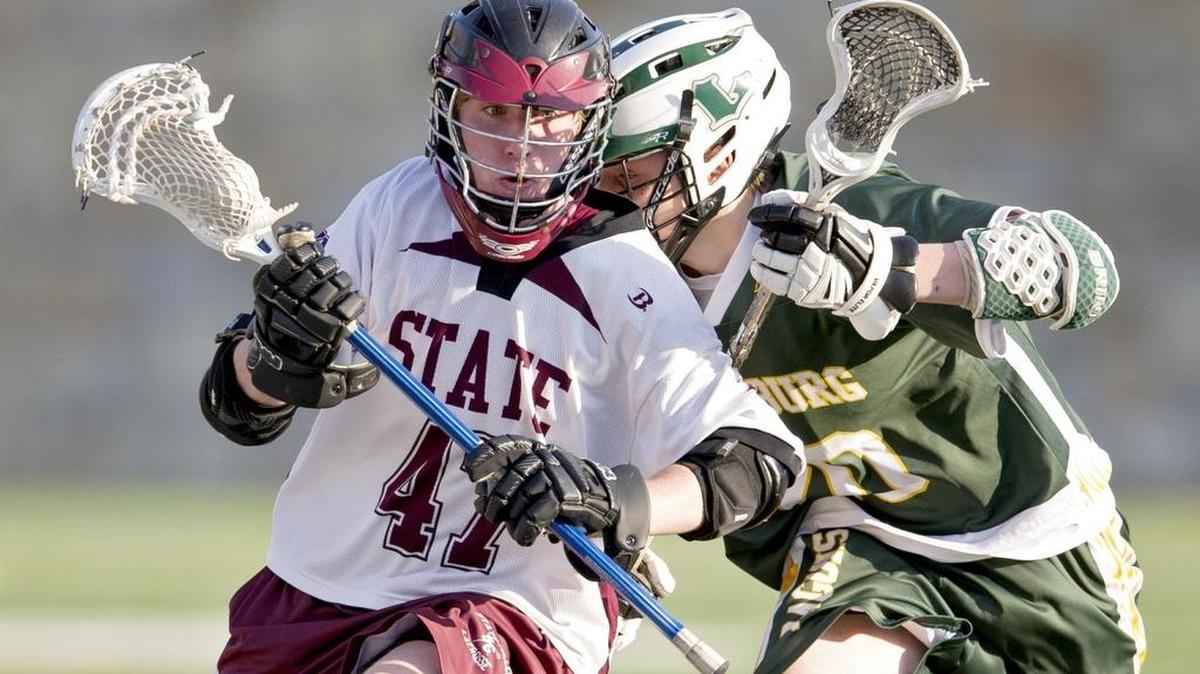 State College's Luke Vidic runs down the field with the ball from a Lewisburg defender during the Little Lions’ 7-6 win on Thursday.