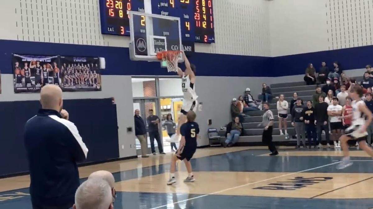 Penns Valley boys basketball forward Zach Braucht (23) dunks the ball with two hands as Bald Eagle guard Alex Gavlock (5) watches on Monday, Jan. 3, 2022.