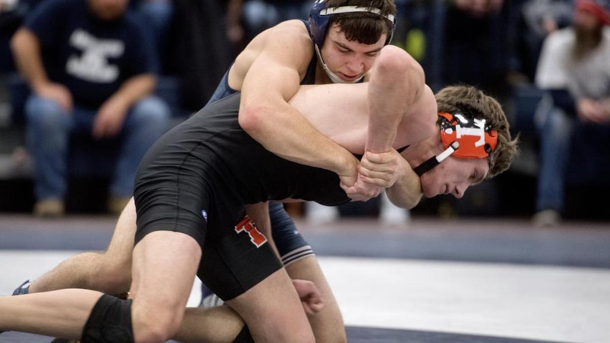 Philipsburg-Oseceola’s Matt Shimmel controls Tyrone’s Sage Dixon in the 152 pound bout during the Mounties’ 45-24 win on Thursday, January 12, 2017. Dixon ended up getting the win by decision, 5-1.