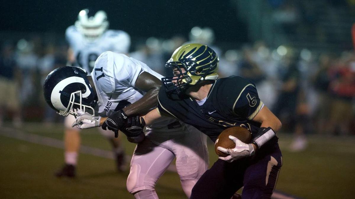 Bald Eagle Area’s Derek Henry tries to throw a stiff arm during last season’s meeting against Penns Valley. Henry and the Eagles have not beaten the Rams in their last three tries; they’ll try to change that Friday night.