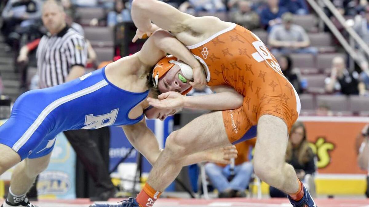 Reynolds’ Cole Matthews tries to take down Saint Joseph's Caleb Dowling in the 138 lb championship bout at the PIAA Wrestling Championships on Saturday, March 10, 2018 at the Hershey Giant Center. Matthews won by decision, 5-2.