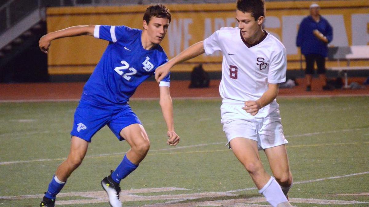 State College’s Jake Hall works against Lower Dauphin’s Blake Cassell during the second half of their matchup in the Mid-Penn title game Thursday. Lower Dauphin won 4-0.