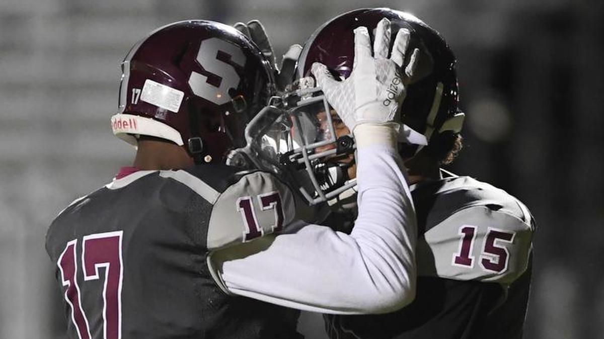 State College wide receiver Brandon Clark (15) celebrates with running back Isaiah Edwards after Clark's touchdown during a game against Erie. Clark is now the county’s leading receiver with 38 catches for 631 yards.