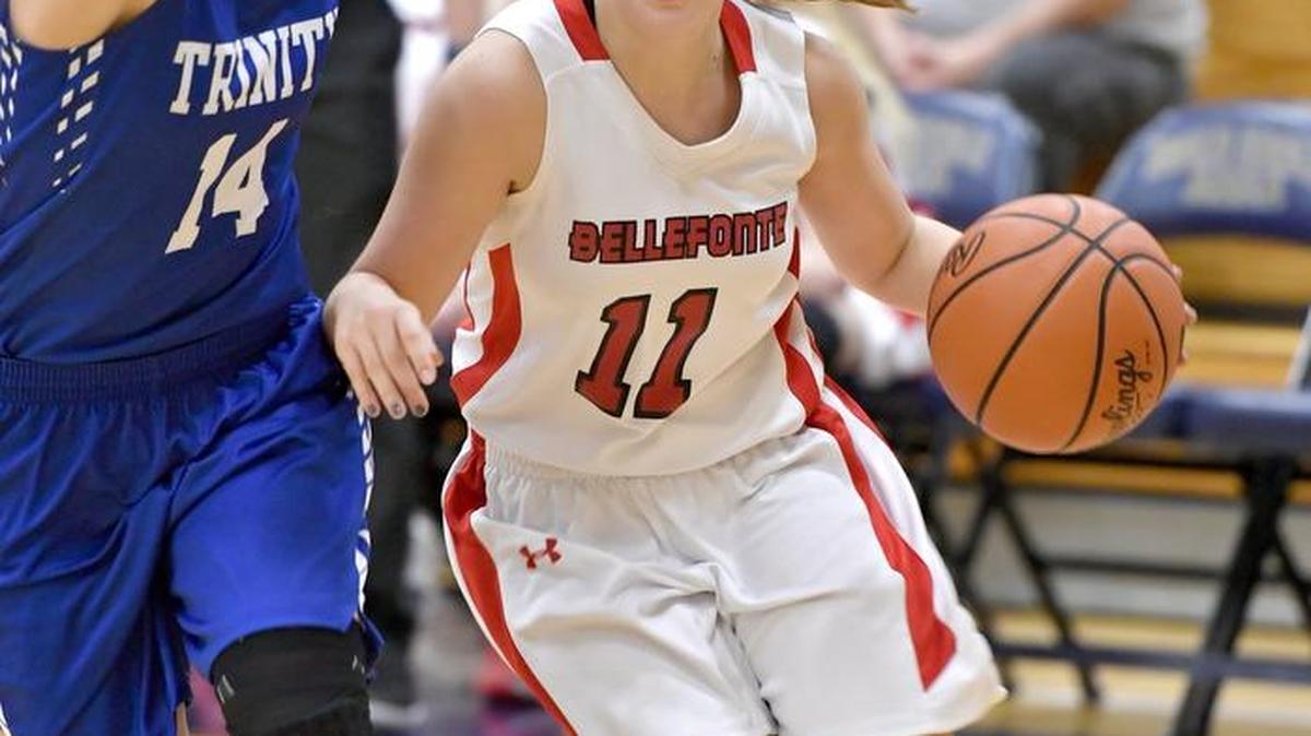 Bellefonte’s Maddie Steiner dribbles around Trinity’s Sierra Kotchman during Saturday’s playoff game at Bald Eagle Area High School. Trinity won 67-22.