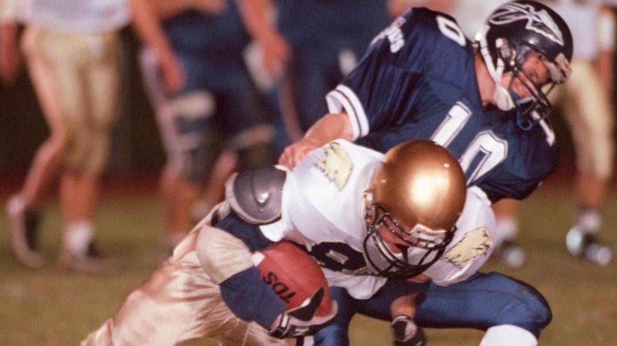 BEA’s Preston Kresovich is tackled by Brookville’s Shawn Bailey (10) after Kresovich made a catch it a District 6-9 playoff game in Brookville on Oct. 31, 1997. BEA upset Brookville 34-27.