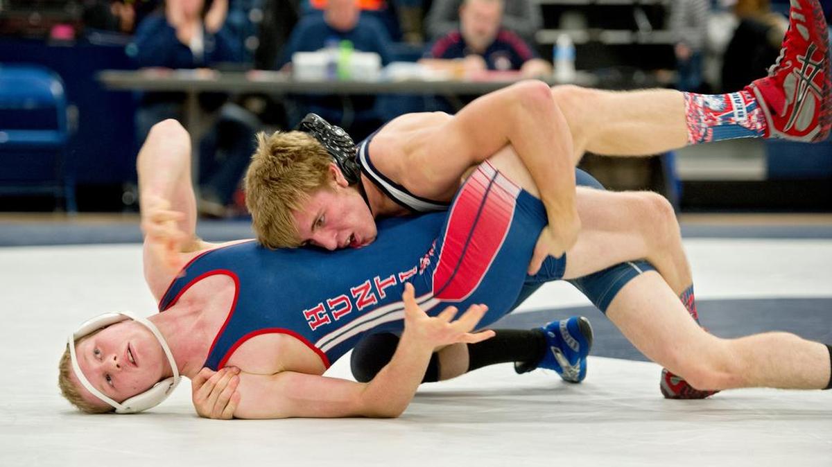 Philipsburg-Osceola’s Braedon Butler controls Huntingdon’s Hunter Rhone in the 106 pound bout during the Thursday match. Butler won by fall. Below: P-O’s Micah Sidorick controls Huntingdon’s Logan Fisher in the 220 pound bout. Fisher won by decision, 5-3.