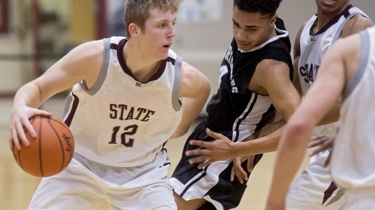 State College's Drew Friberg pushes past Harrisburg's Na'reece Glenn on Tuesday night. Friberg finished with 26 points.