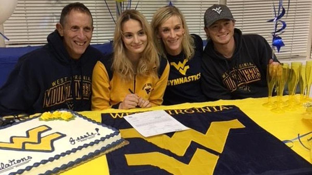 Jessie Bastardi, with her parents, Joe and Jess Bastardi, and brother, Garrett Bastardi, signed her National Letter of Intent with West Virginia on Wednesday.