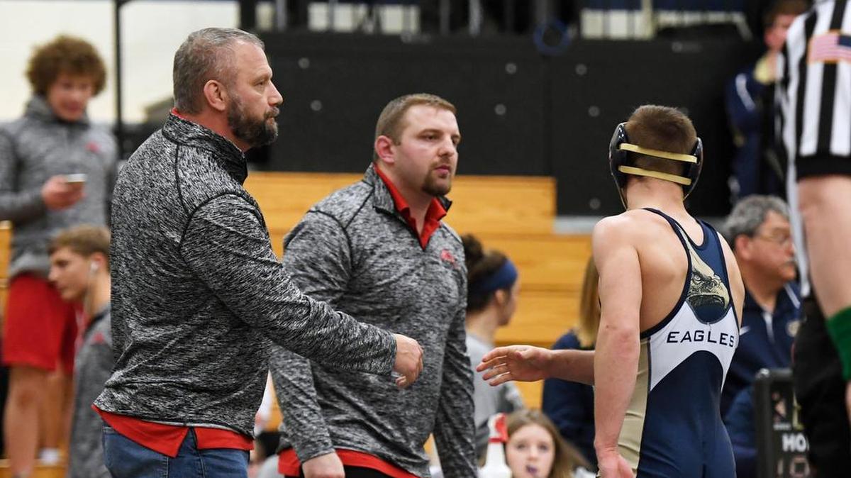 Fauquier head wrestling coach Doug Fisher, left, shakes hands with Bald Eagle Area’s Seth Koleno during the Bald Eagle Area Wrestling Duals Saturday, Jan. 6, 2017 at Bald Eagle Area High School. Fisher competed for the Eagles from 1988-1991 and has several ties to current BEA coach Ron Guenot and Bellefonte coach Mike Maney.