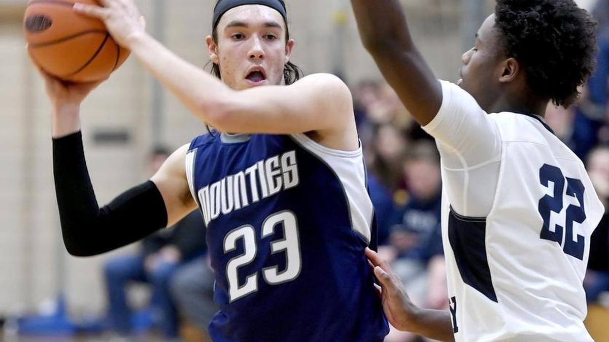 Philipsburg-Osceola's Noah Jeffries passes the ball around Penns Valley's Marcus Woodford during the Monday, December 19, 2016 game.