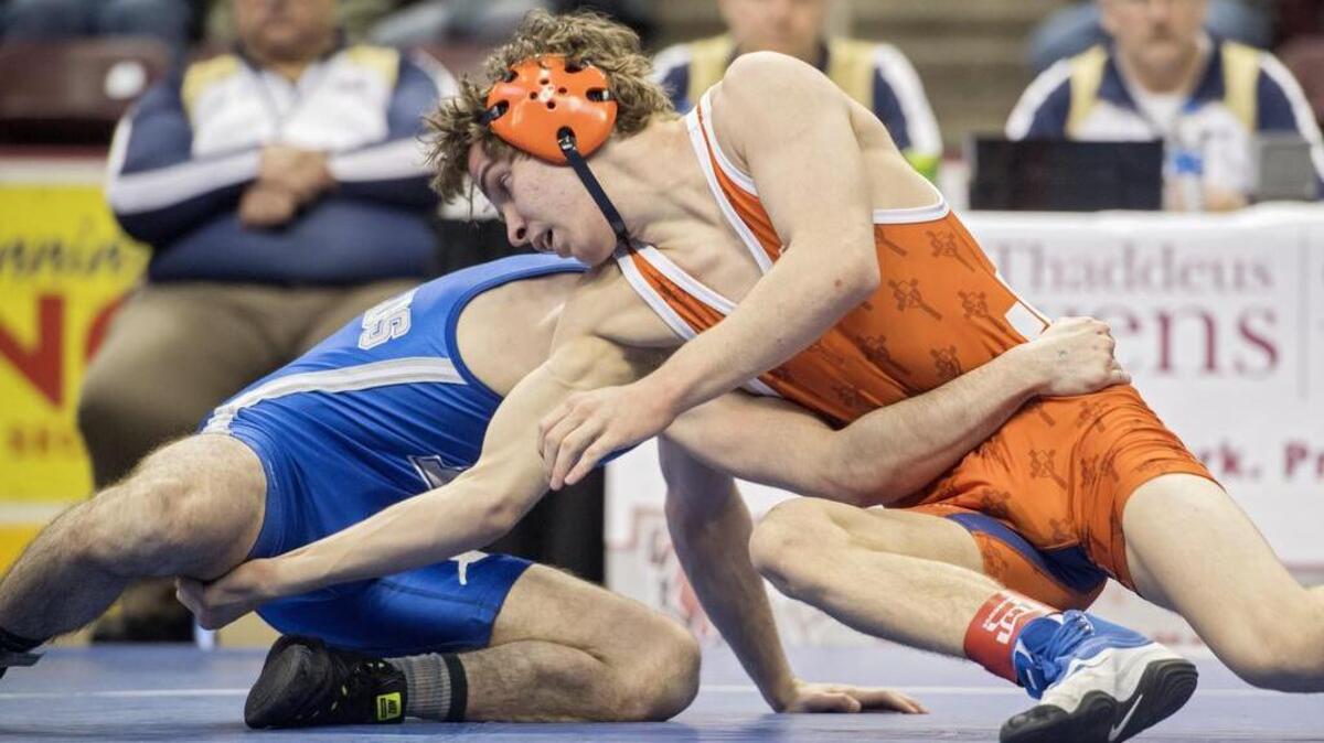 Saint Joseph's Zach Witmer reaches for Reynold's Andrew Ischo in the 120 lb fifth place match at the PIAA State Championship wrestling at the Giant Center on Saturday, March 10, 2018. Witmer won 2-0 to take fifth in the state.