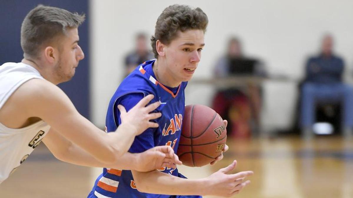 Saint Joseph’s R.J. Marsh dribbles down the court with the ball around a Bald Eagle Area defender on Wednesday. Saint Joseph’s won, 70-58.