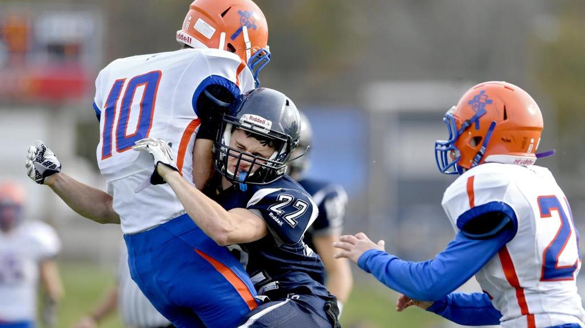 Philipsburg-Osceola's Matt Johnson tackles Saint Joseph's Jake Stormer as he makes a catch during a game last season. P-O is hoping its extra dedication and enthusiasm pays off this season in the form of multiple wins.