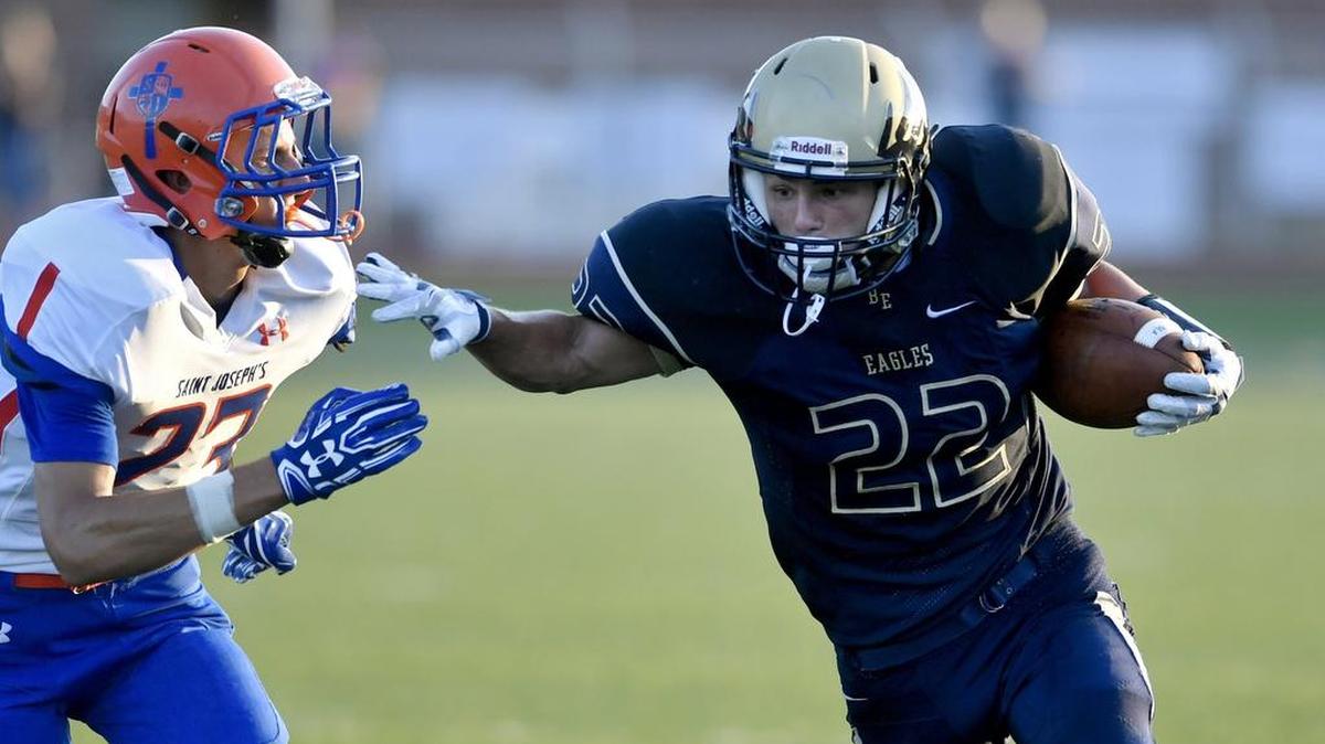 Bald Eagle Area's Gage McClenahan is chased by Saint Joseph's Christian Chirieleison during the Friday, August 25, 2016 game. Bald Eagle Area won the season opener, 54-0.