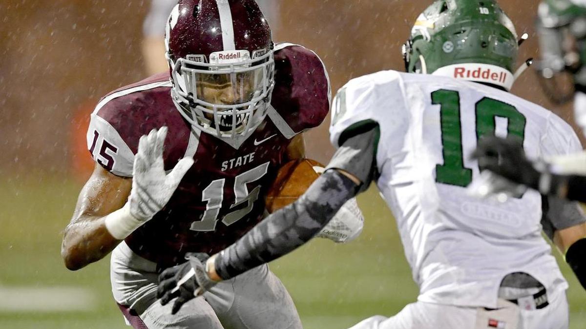 State College’s Brandon Clark runs 65 yards for a touchdown against Carlisle on Friday. State College won, 70-14.