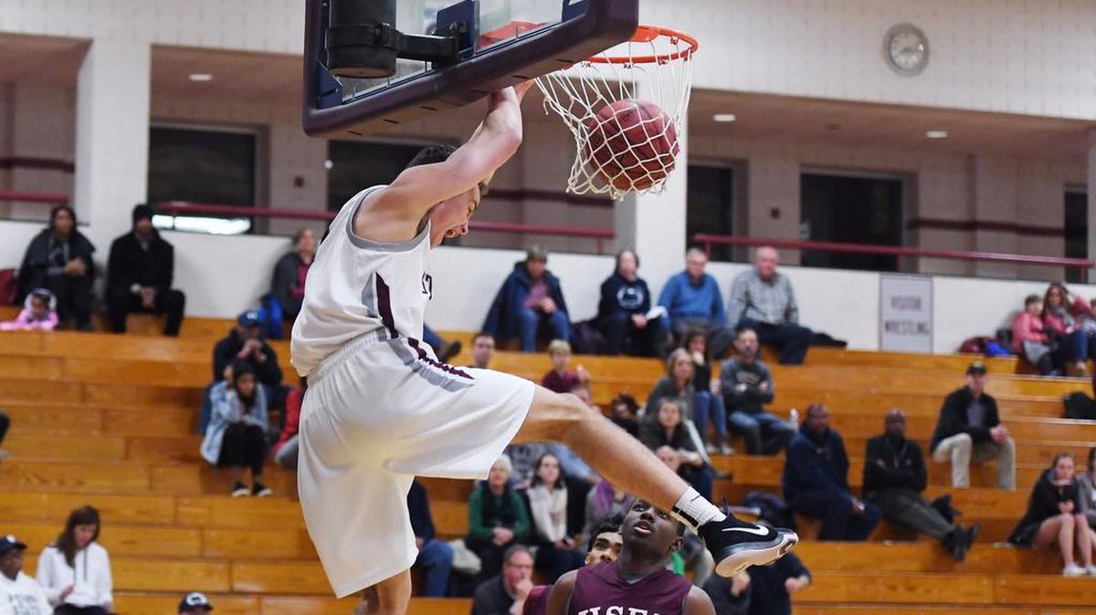 State College's Ryan McNulty dunks against the High School of Economics and Finance on Friday at State College Area High School.