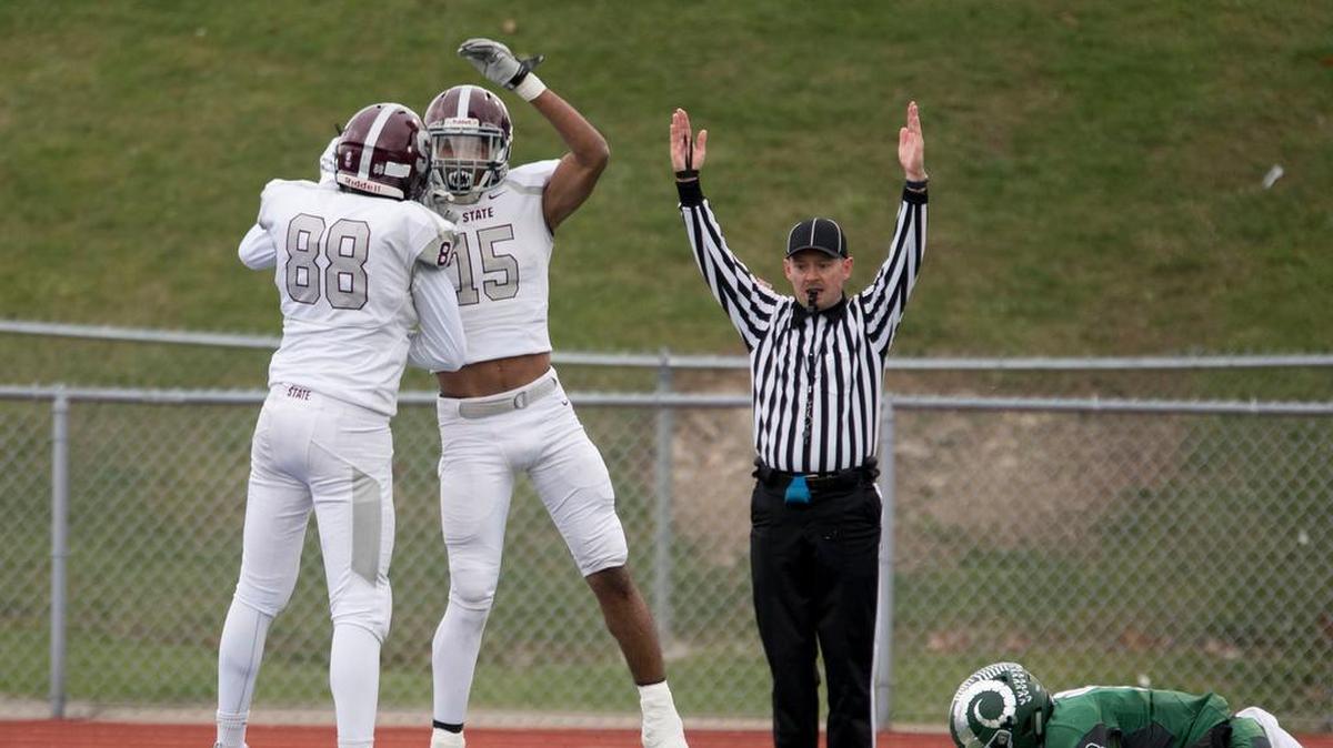 State College wide receiver Brandon Clark (15) celebrates with Jeremy Bullock after catching a touchdown against Pine-Richland on Saturday. Clark finished this season with 16 touchdown receptions — the most in a season in county history.