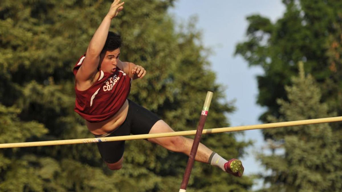 State College Area High School pole vaulter Griffin Thompson clears the bar at the PIAA District 6 Championships in Altoona, Pa., May 14, 2015.