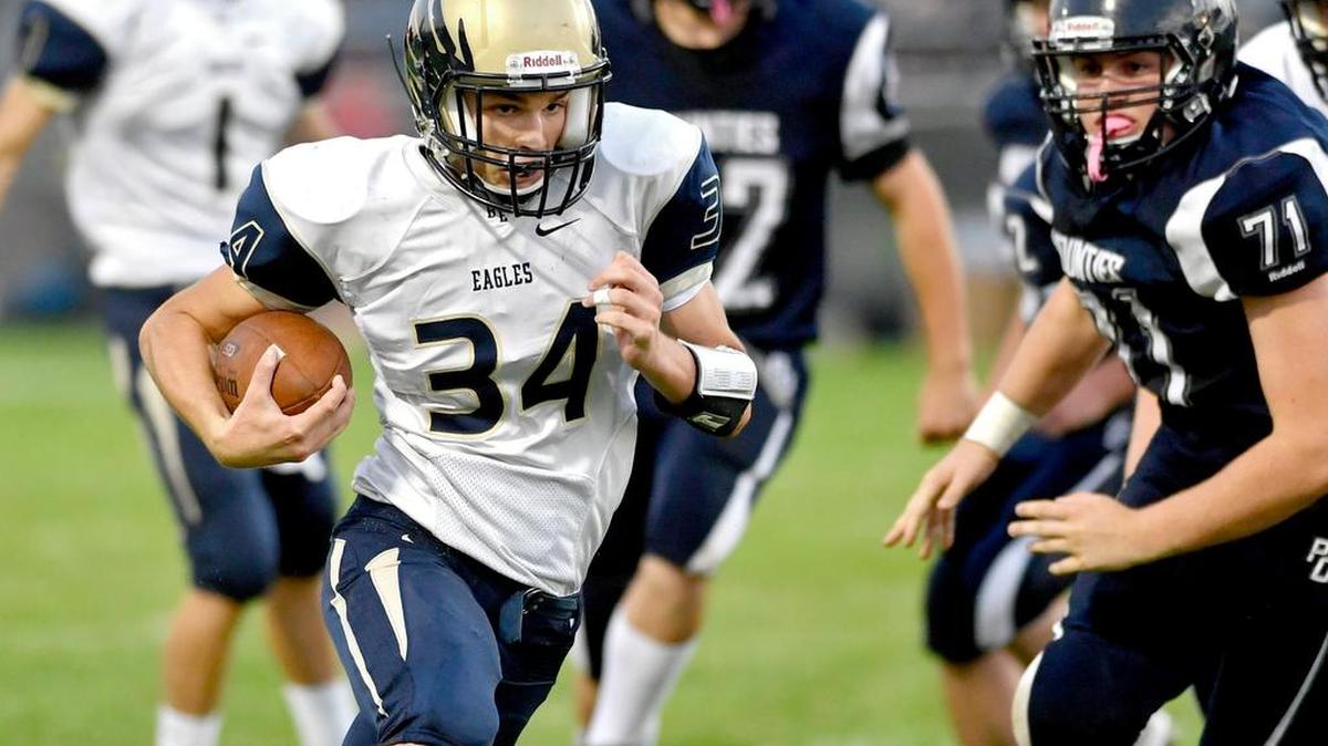 Bald Eagle Area’s Andrew Dubbs runs down the field from Philipsburg-Osceola defenders last season.
