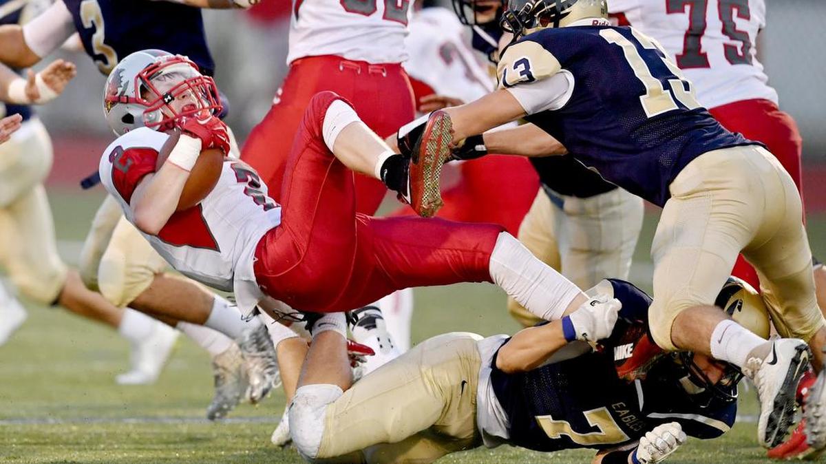 Bald Eagle Area’s Kael Gardner (7) helps trip up Central’s Trystan Detwiler in a game last month. Gardner has 118 tackles on the season.