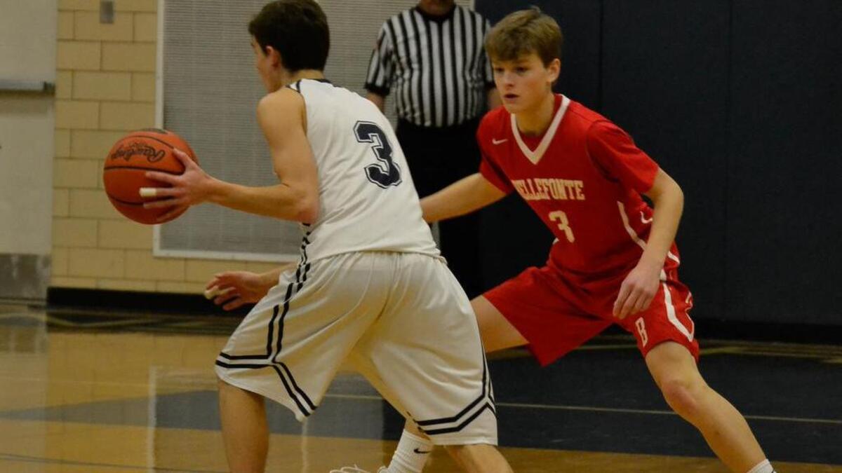 Bellefonte's Nathan Tice defends the basket against Mifflinburg's Levi Yoder