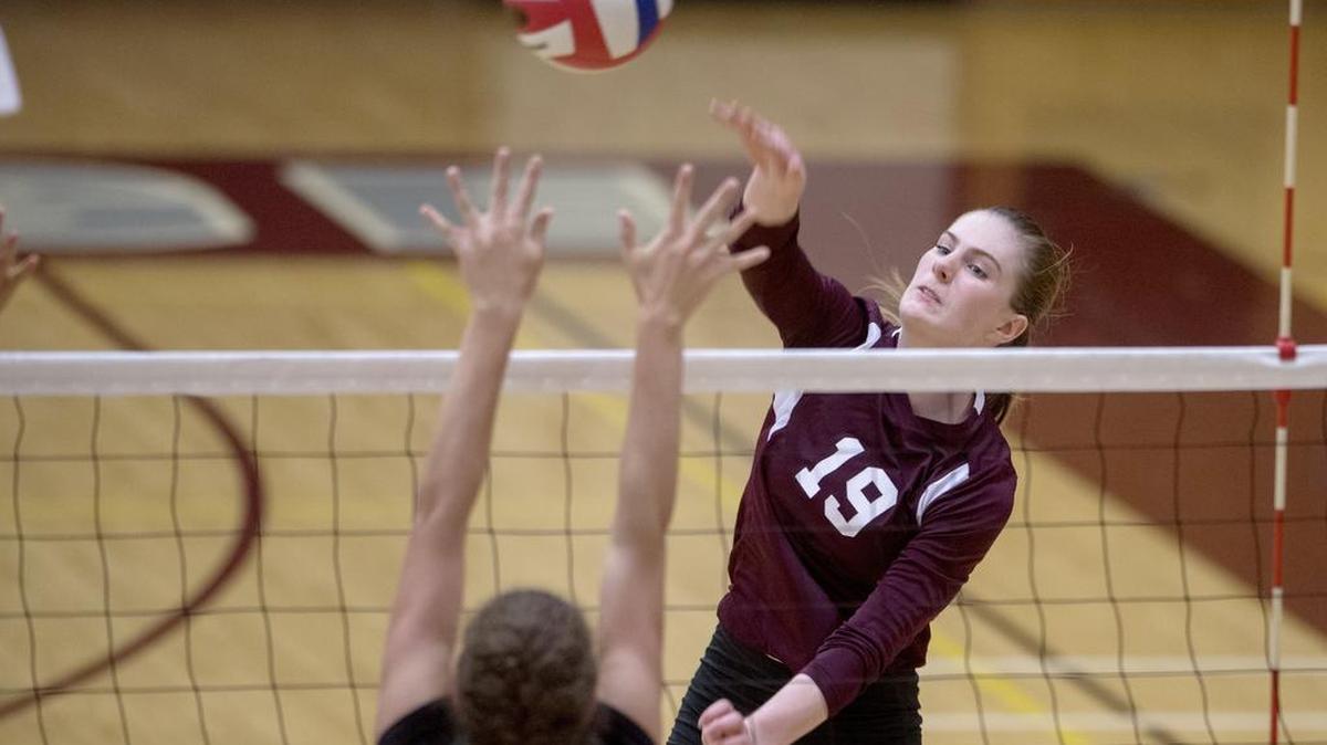 State College's Alli Henderson hits the ball over a Carlisle defender during the match Tuesday .