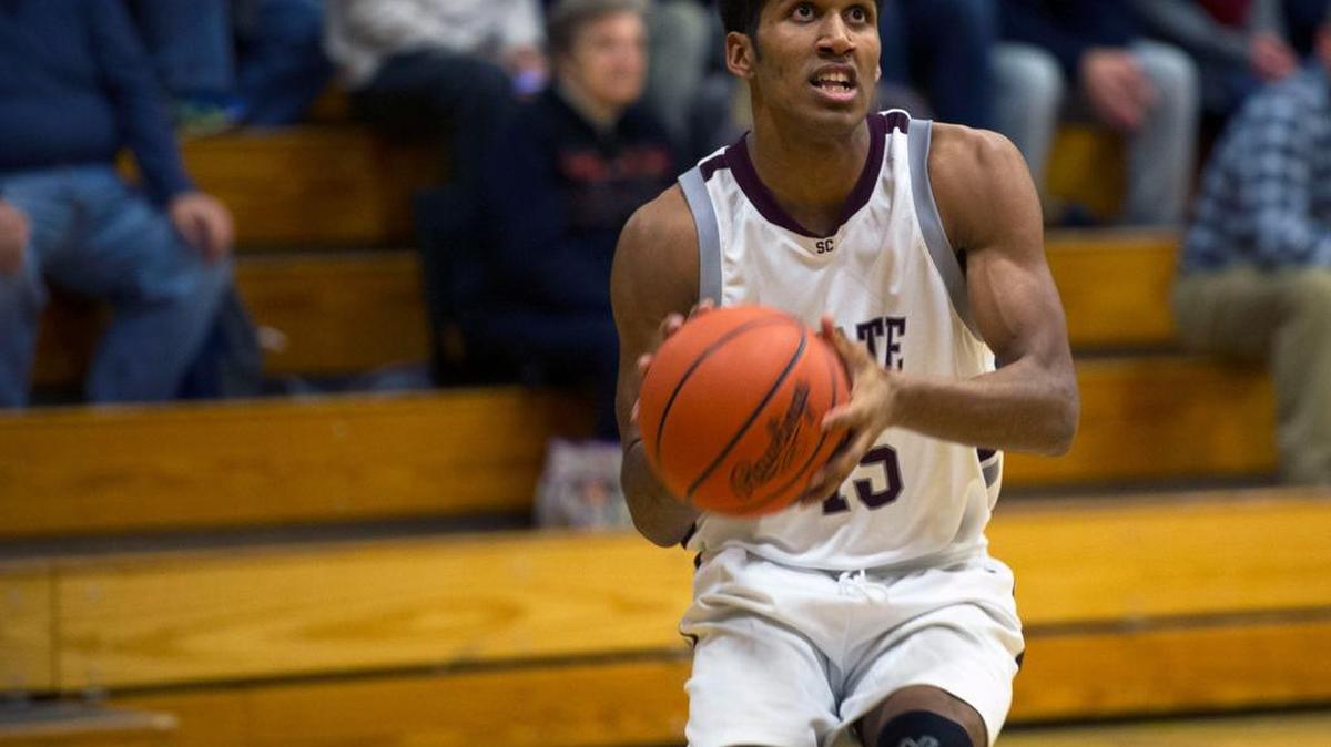 State College junior Brandon Clark sets up to shoot the ball.