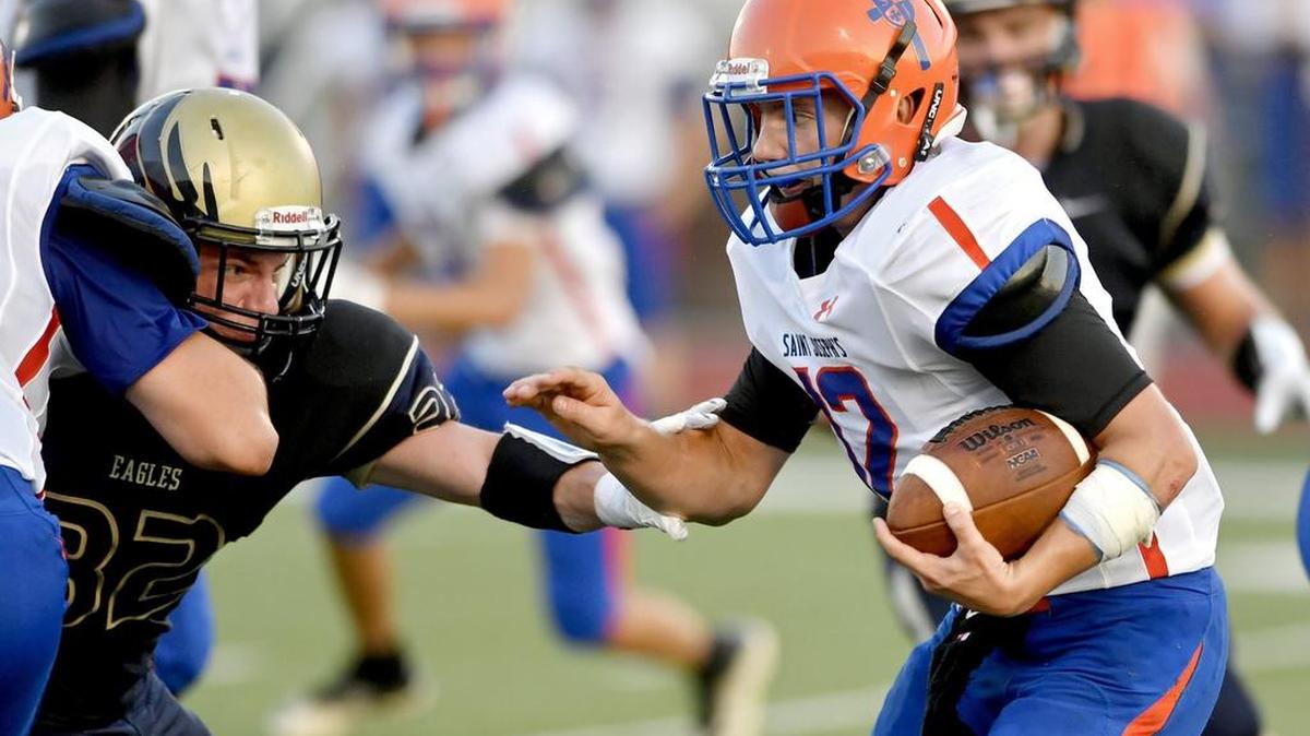 St. Joseph’s Brendan Robinson runs against Bald Eagle Area defense during the season opener in August. St. Joe’s final game was canceled Tuesday, ending the season for the Wolves.