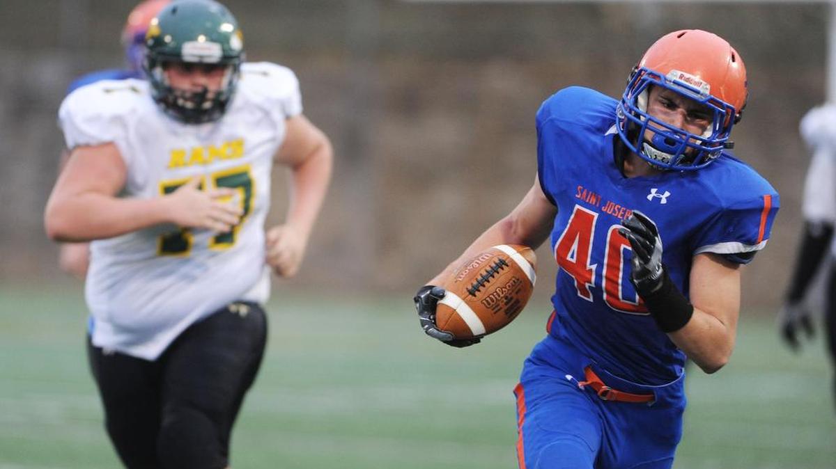 St. Joseph’s Zac Sechler runs the ball down the field during a game against Columbia Montour Vo-Tech on Saturday at Memorial Field in State College.
